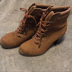 Brown boots with laces.